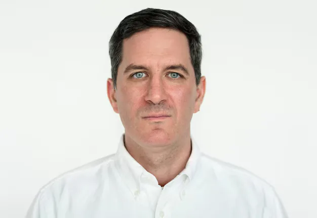 A man photographed against a plain white background