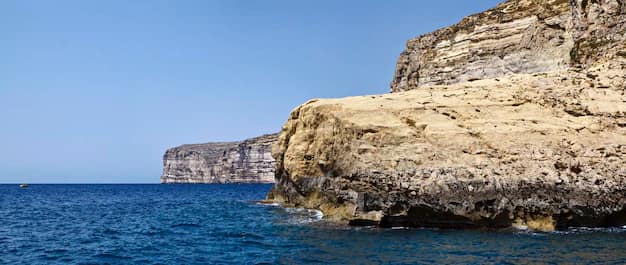 Rocky coastline and clear blue sea in Malta