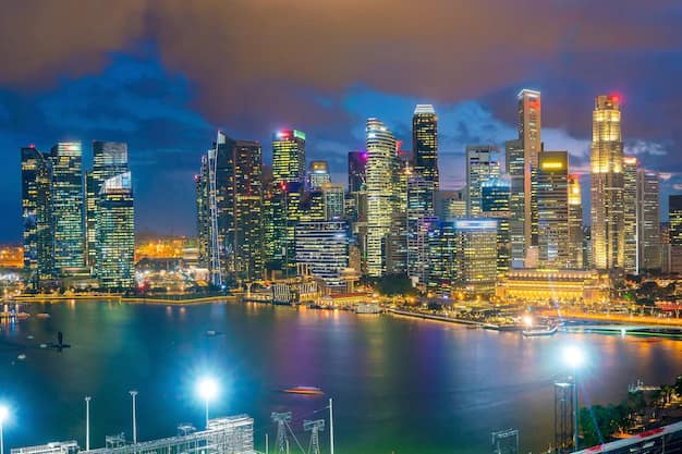 Singapore skyline at twilight with Marina Bay Sands and Gardens by the Bay lit up over the water